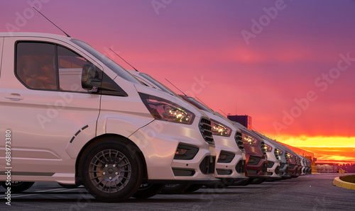 row of generic cargo vans in the parking lot photo