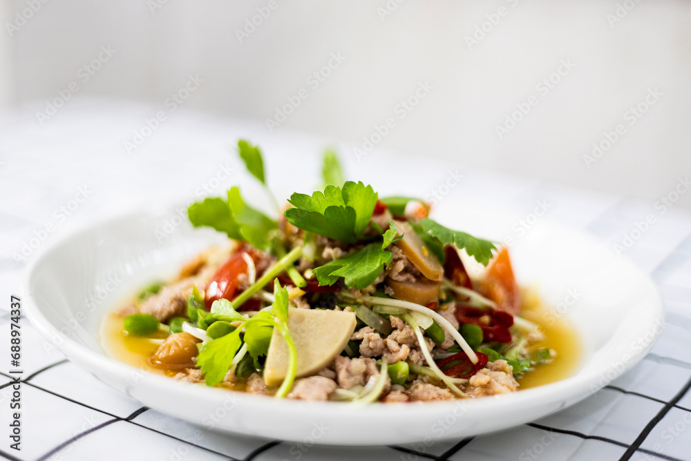 Spicy Mixed Salad on white dish, select focus. Spicy mixed seafood. Spicy Mixed Salad on white dish, select focus. Spicy mixed seafood.