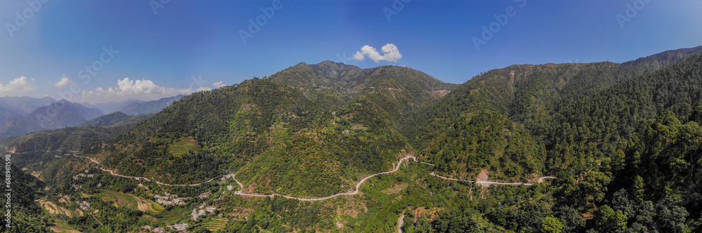 aerial panorama of a road through the mountains