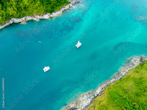 Aerial view seashore with mountains at Phuket Thailand, Beautiful seacoast view at open sea in summer season,Nature recovered Environment and Travel background