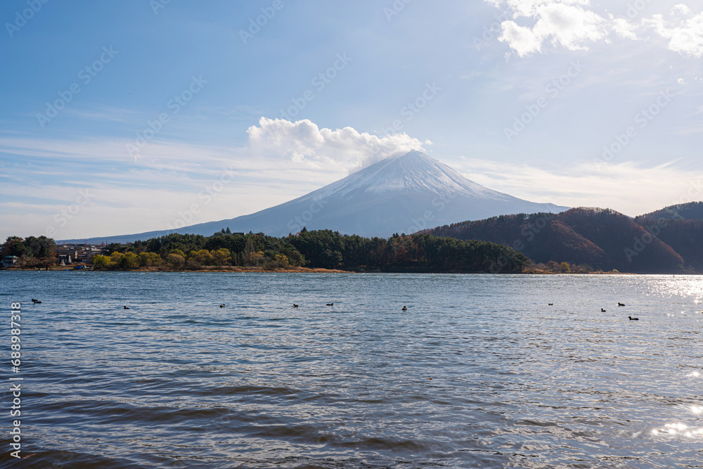 Colorful Autumn Season and Mountain Fuji with morning fog and red leaves at lake Kawaguchiko is one of the best places in awaguchiko Lake, Japan.