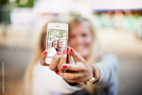 Selfie, phone screen and happy festival friends, women or people smile for fun bonding, social gathering or memory picture. Event picture, cellphone photography or girl hands post to social media app