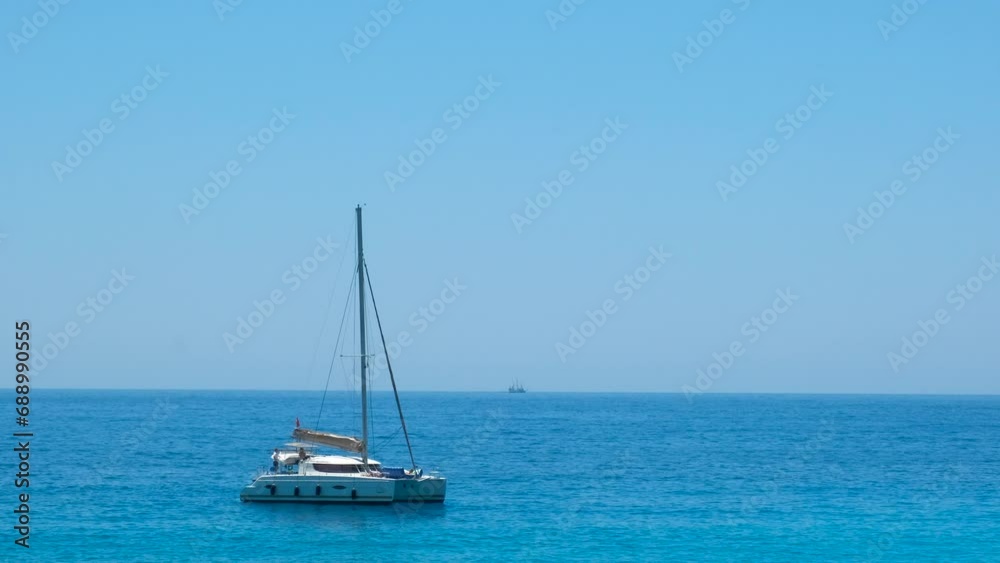 Sailing ship approach to sunny bay. A fishing motor ship approach to bay in the turquoise sea in the sun. Sailing ship approach to sunny bay. A fishing motor ship approach to bay in the turquoise sea in the sun.