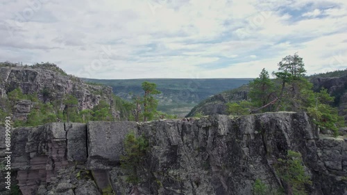 A drone flies forward presenting the beautiful landscape of the Jutulhogget in Norway photo