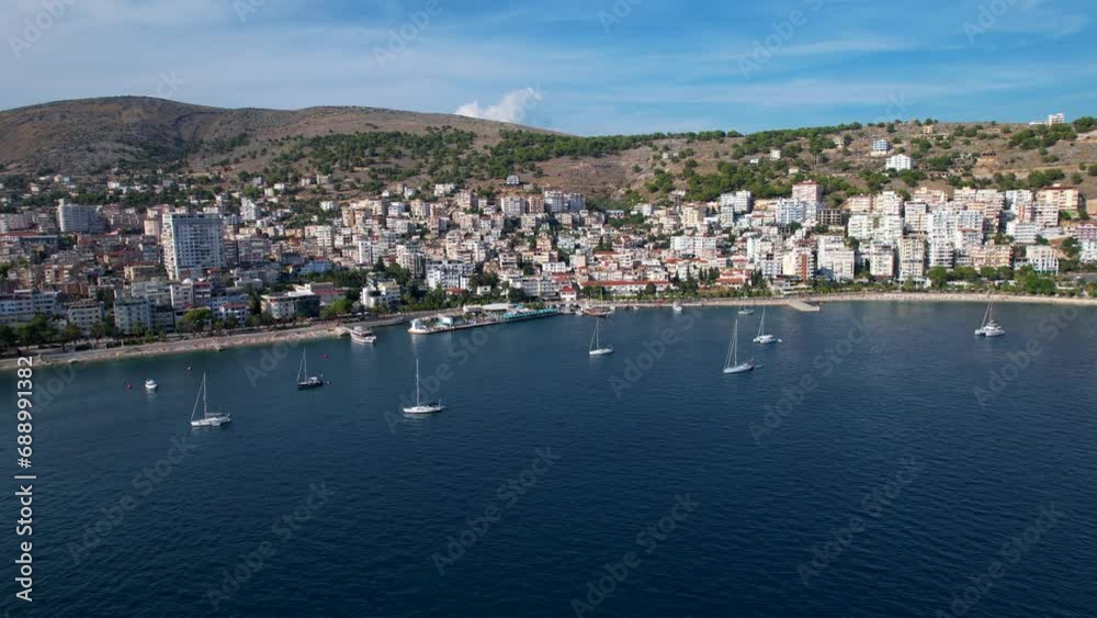 Panoramic Blue Bay of Saranda, Yachts Grace the Beautiful Coastal Vista, Inviting Vacationers to Embrace Summer by the Sea Panoramic Blue Bay of Saranda, Yachts Grace the Beautiful Coastal Vista, Inviting Vacationers to Embrace Summer by the Sea