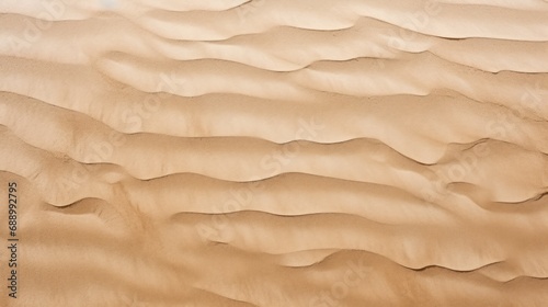 Brown on beige wave sand on beach texture background photo