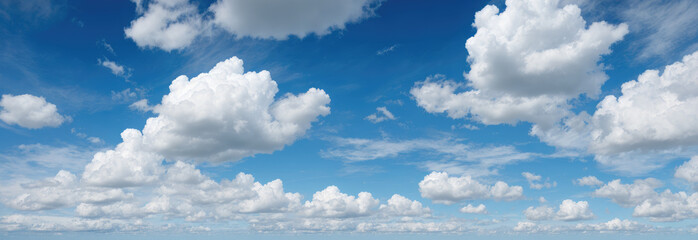 blue sky background with clouds. wide web banner. Blue sky and white clouds floated in the sky on a clear day with warm sunshine combined with cool breeze