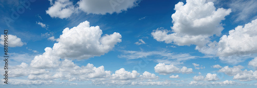 blue sky background with clouds. wide web banner. Blue sky and white clouds floated in the sky on a clear day with warm sunshine combined with cool breeze