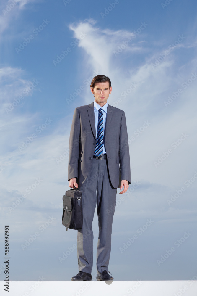 Portrait, briefcase and a business man on a blue sky background for International travel or a journey. Corporate, work and a confident young professional employee outdoor during summer for a trip Portrait, briefcase and a business man on a blue sky background for International travel or a journey. Corporate, work and a confident young professional employee outdoor during summer for a trip