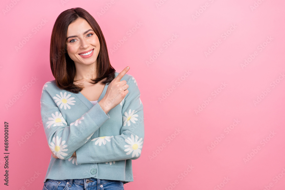 Photo of confident cute lady direct finger shopping poster advertise wear print cardigan isolated pink color background Photo of confident cute lady direct finger shopping poster advertise wear print cardigan isolated pink color background