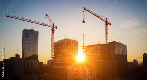 Construction site with tower crane. Construction of residential buildings. Panoramic view of construction of skyscrapers.
