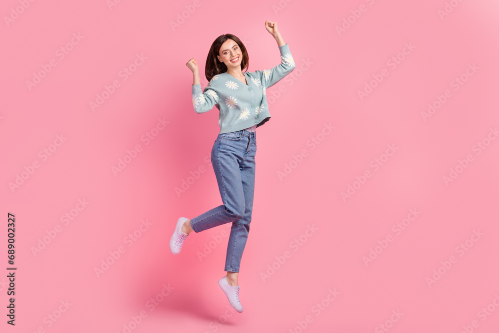 Full body photo of jumping optimistic woman fists up hooray wear trendy outfit final season sale promo ad isolated on pink color background