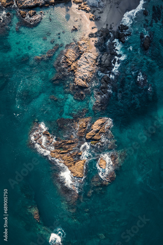 aerial view of rocks in the ocean