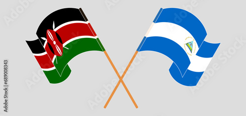 Crossed and waving flags of Kenya and Nicaragua
