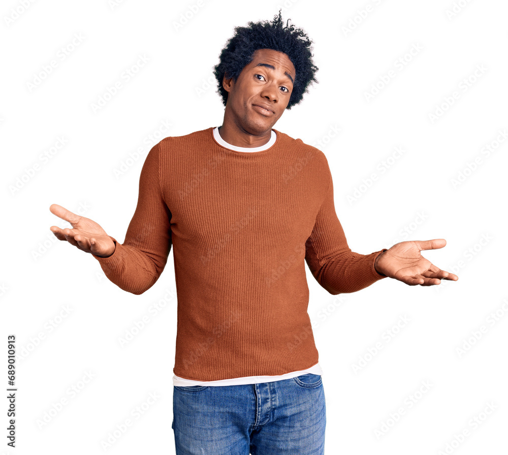 Handsome african american man with afro hair wearing casual clothes clueless and confused expression with arms and hands raised. doubt concept. Handsome african american man with afro hair wearing casual clothes clueless and confused expression with arms and hands raised. doubt concept.