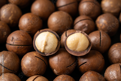 Close up of peeled macadamia nuts background.