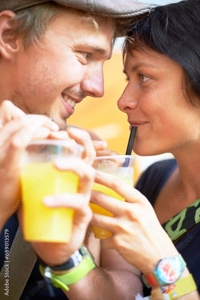 Couple, orange juice and love with happiness, marriage and health with wellness, nutrition and vitamin c. Romance, man and woman with a drink, summer and bonding together with relationship and joy Couple, orange juice and love with happiness, marriage and health with wellness, nutrition and vitamin c. Romance, man and woman with a drink, summer and bonding together with relationship and joy