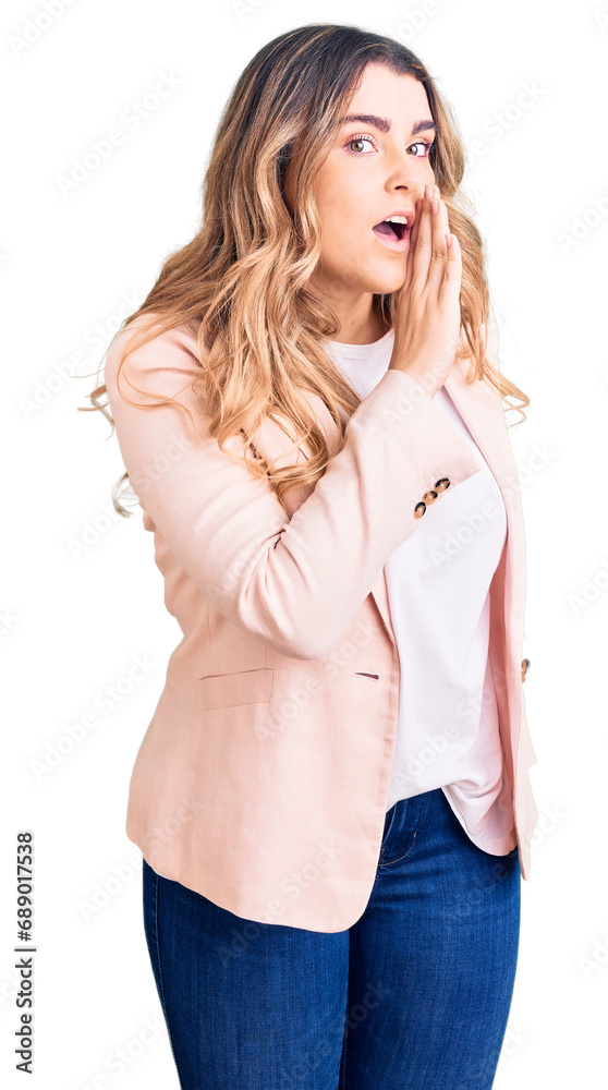 Young caucasian woman wearing business clothes hand on mouth telling secret rumor, whispering malicious talk conversation Young caucasian woman wearing business clothes hand on mouth telling secret rumor, whispering malicious talk conversation