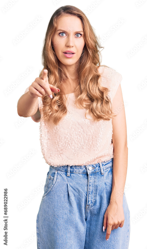 Young beautiful caucasian woman with blond hair wearing casual clothes pointing displeased and frustrated to the camera, angry and furious with you Young beautiful caucasian woman with blond hair wearing casual clothes pointing displeased and frustrated to the camera, angry and furious with you