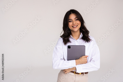 Photo of young attractive woman hold pc tablet hand isolated over grey color background