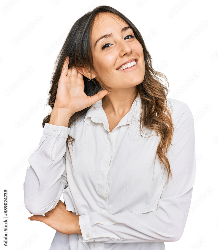 Young brunette woman wearing casual clothes smiling with hand over ear listening an hearing to rumor or gossip. deafness concept. Young brunette woman wearing casual clothes smiling with hand over ear listening an hearing to rumor or gossip. deafness concept.