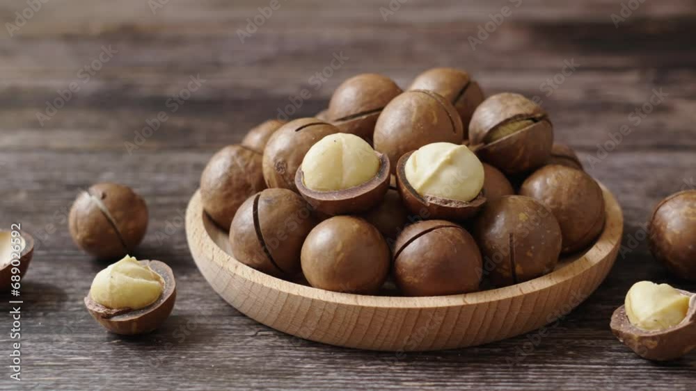 Close up macadamia nuts on wooden background. Close up macadamia nuts on wooden background.