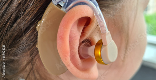 Hearing aid of child and girl suggests hearing aid photo