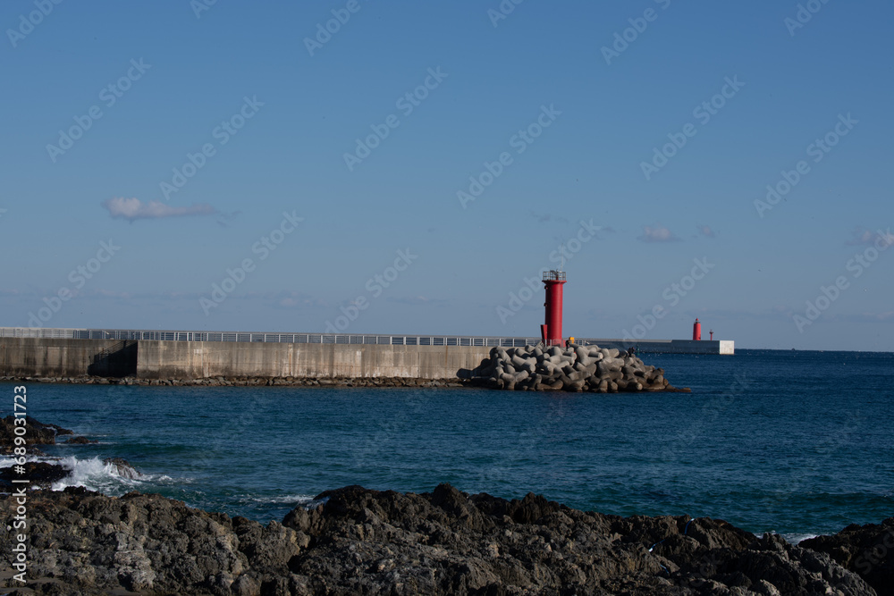 Beach scenery with a lighthouse view