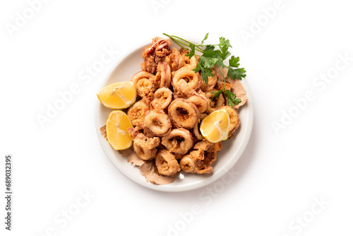 Piatto di calamari fritti visto dall'alto e isolato su fondo bianco, cibo italiano, cucina mediterranea  photo