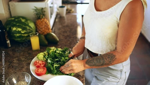 Hands, woman and cutting vegetables for healthy lunch, kitchen and diet for weight loss, food and home. Female person, nutrition and cooking or salad preparation, organic and ingredients for meal photo