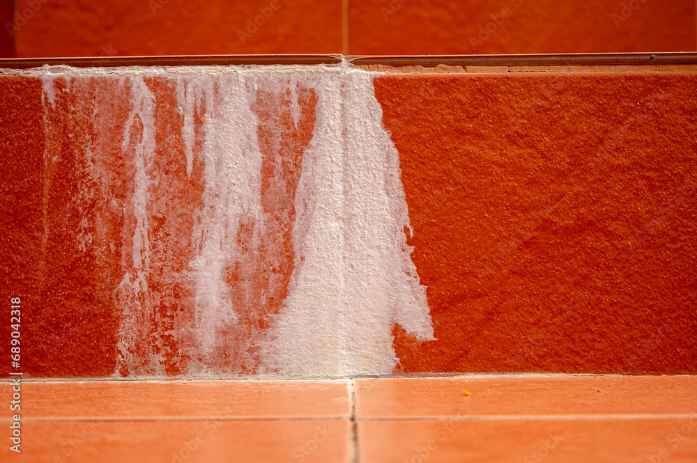 efflorescence, stain on the concrete wall white sediment formed on