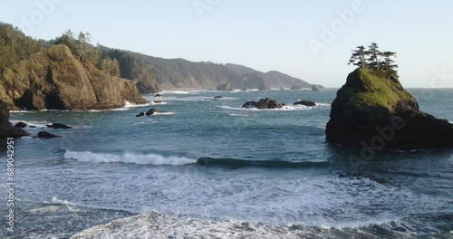 4K Drone Aerial footage of rock cliffs at Secret Beach Samuel Boardman Brookings Oregon photo