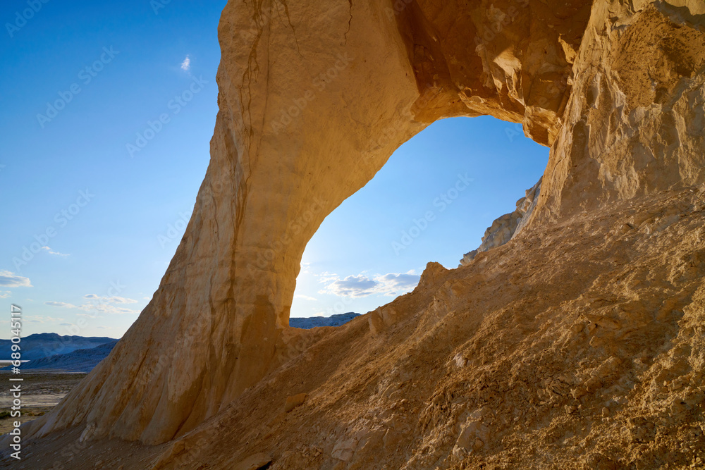  Natural arch on the Tuzbair salt marsh. Natural arch at Tuzbair is a natural formation carved by erosion.Salt marsh Tuzbair is one of the most famous attractions of the Mangystau region of Kazakhstan