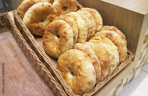 Baskets of Armenian traditional breads for sale in a local bakery shop photo