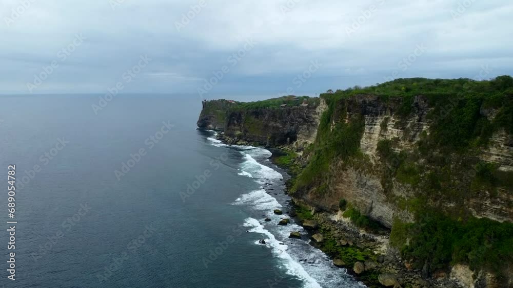 Aerial View By Drone 4K Camera. Ocean With Waves And Rocky Cliff. Aerial View By Drone 4K Camera. Ocean With Waves And Rocky Cliff.