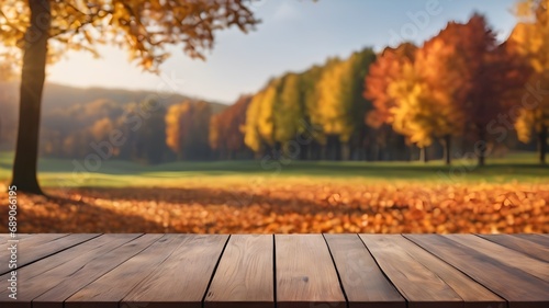the empty wooden table top with blur background of autumn tree  display product