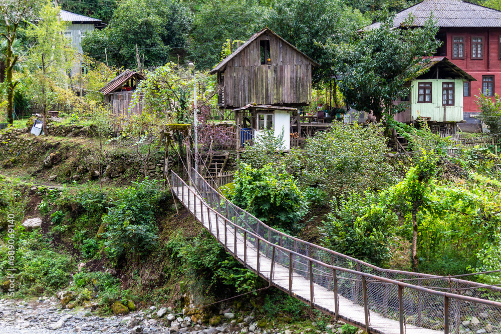 Φωτογραφία travel to Georgia - suspension bridge with wood flooring in Scurdidi village ove
