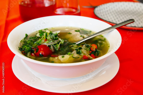 travel to Georgia - Khashlama lamb soup with fresh herbs and vegetables in local cafe in Batumi city photo