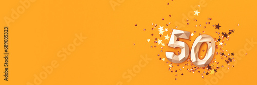 Banner with golden number fifty and stars confetti on a yellow background. Festive concept with place for text. photo