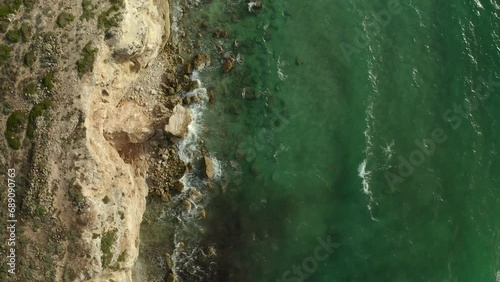 Wallpaper Mural Aerial drone top view of waves crashing on a wild beach with cliffs Torontodigital.ca