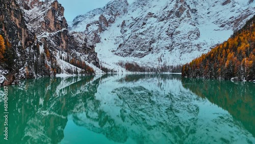 Aerial drone view of Lake Briers Pragser Wildsee Dolomites South Tyrol Italy. Autumn mountain landscape. High quality 4k footage photo