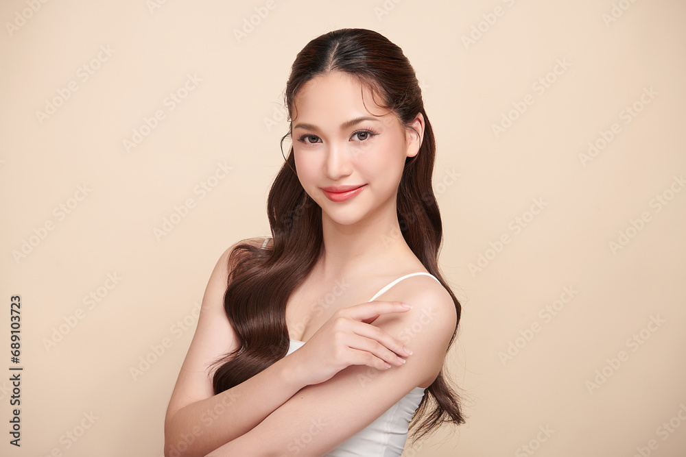 Beautiful young asian woman with clean fresh skin on beige background, Face care, Facial treatment, Cosmetology, beauty and spa, Asian women portrait. Beautiful young asian woman with clean fresh skin on beige background, Face care, Facial treatment, Cosmetology, beauty and spa, Asian women portrait.