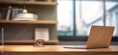 Sleek office setup. Modern laptop on wooden table. Digital workspace. Desk with pc and blank screen. Tech haven. Empty workplace with computer