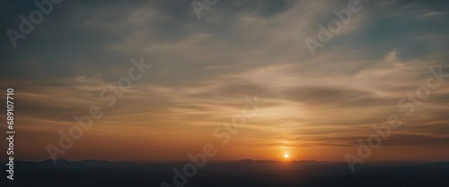 view of sunset and cloudy sky viewed from mountain top

