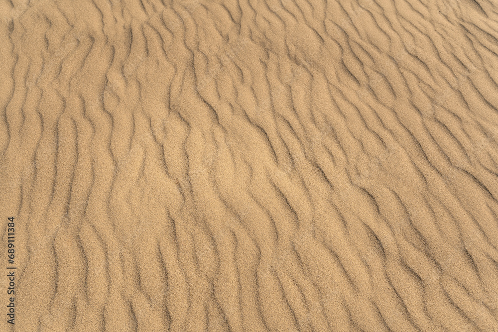 Yellow sand, setting a serene ambiance backdrop. Top view, copy space. Yellow sand, setting a serene ambiance backdrop. Top view, copy space.