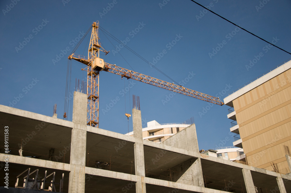 The foundation on reinforced concrete piles and the frame during the construction of a multi-storey building. The foundation on reinforced concrete piles and the frame during the construction of a multi-storey building.