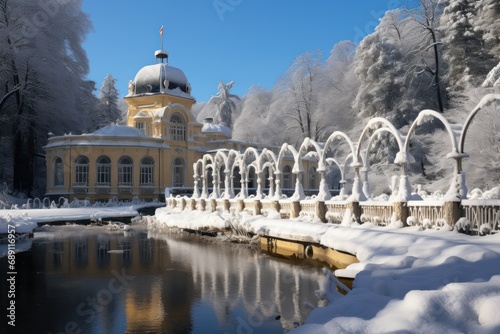Great Czech spa town Marianske Lazne (Marienbad) in winter - colonnade, fountain and pavilion of mineral water springs under snow photo