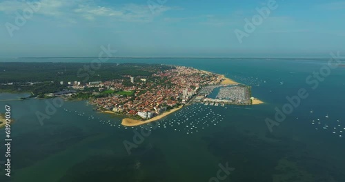 Aerial view of coastal Arcachon city with moored boats. Popular tourist destination for ocean holidays in summer photo
