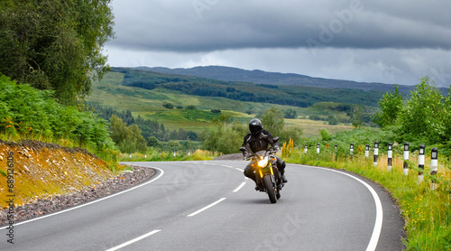 Motorcyclist Touring Scottish Highlands