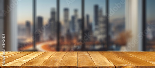 Wooden desk of free space and winter window background with city landscape.  photo